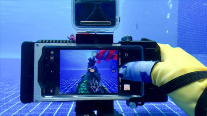 Diver using Seatouch 4 Max underwater housing and finger cot.