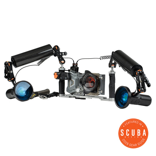 Underwater camera housing with lights and arm on a white background, featuring 'Scuba 2026 Gear Guide'.
