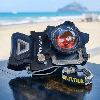 DiveVolk SeaTouch 4 Max housing with wide-angle lens on beach.