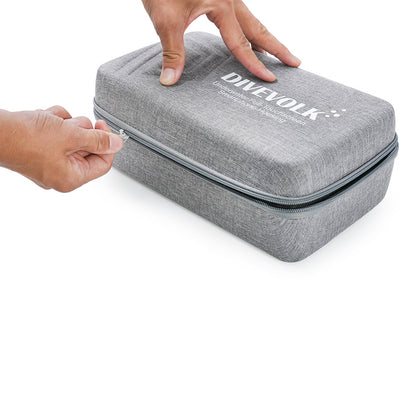 Hands zipping open DIVEVOLK travel case ¡ª grey EVA hard shell with heavy-duty zipper showing compact and portable design.