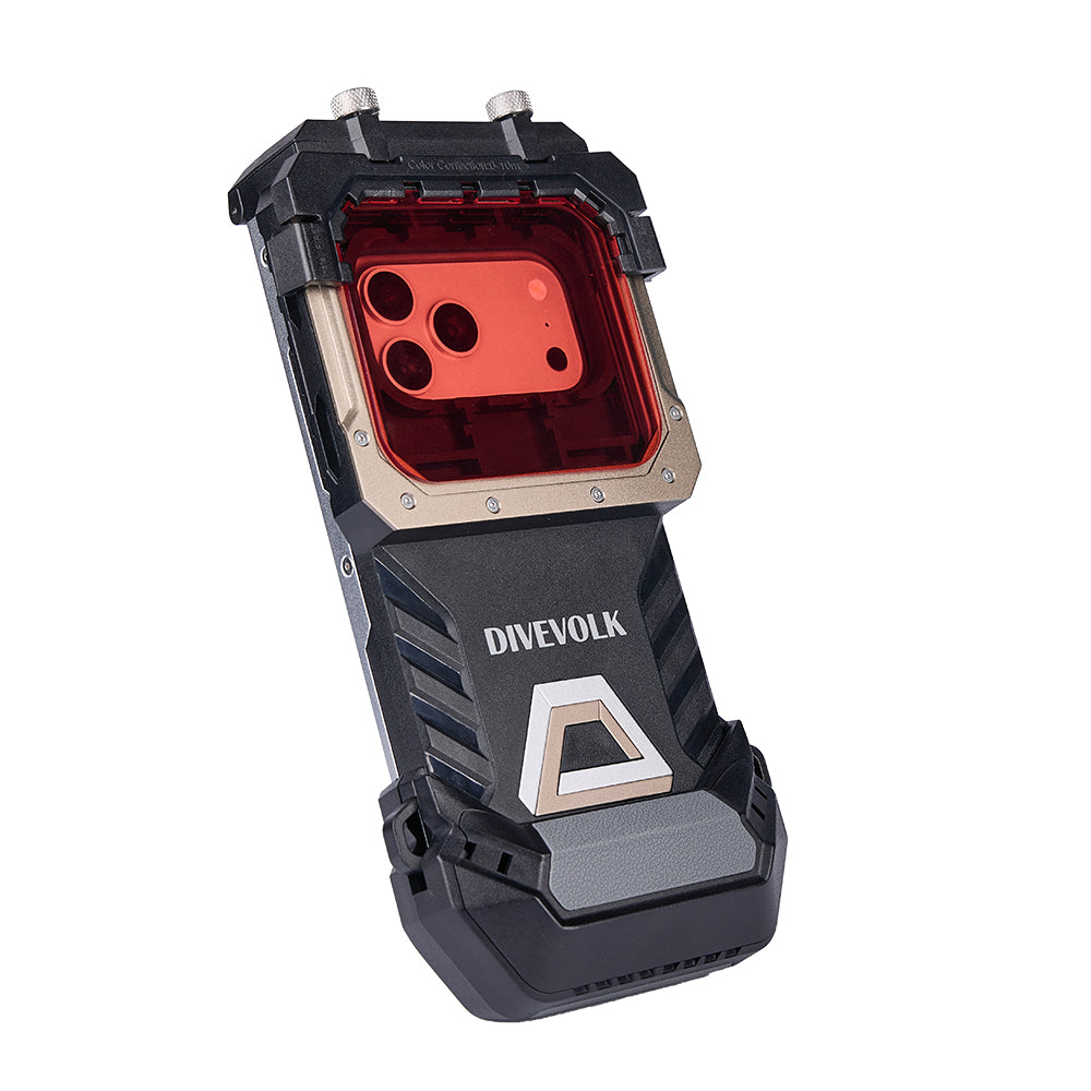 Angled view of the DIVEVOLK SeaTouch 6 Pro underwater smartphone housing on a white background, showcasing the champagne-gold metal frame with a red filter installed over the transparent window, the phone's triple-lens camera visible through the red filter, and the black rugged lower body with the DIVEVOLK logo and geometric triangle emblem.