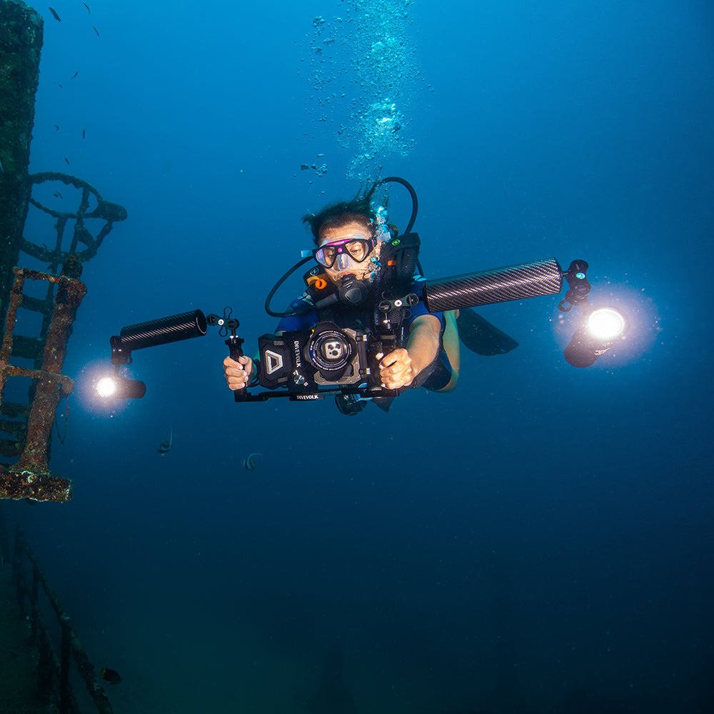 Diver with DiveVolk SeaTouch 4 Max filming wreck.
