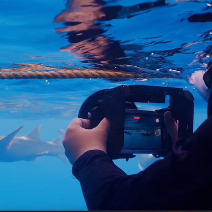 Diver using SeaTouch 4 Max to film sharks underwater.